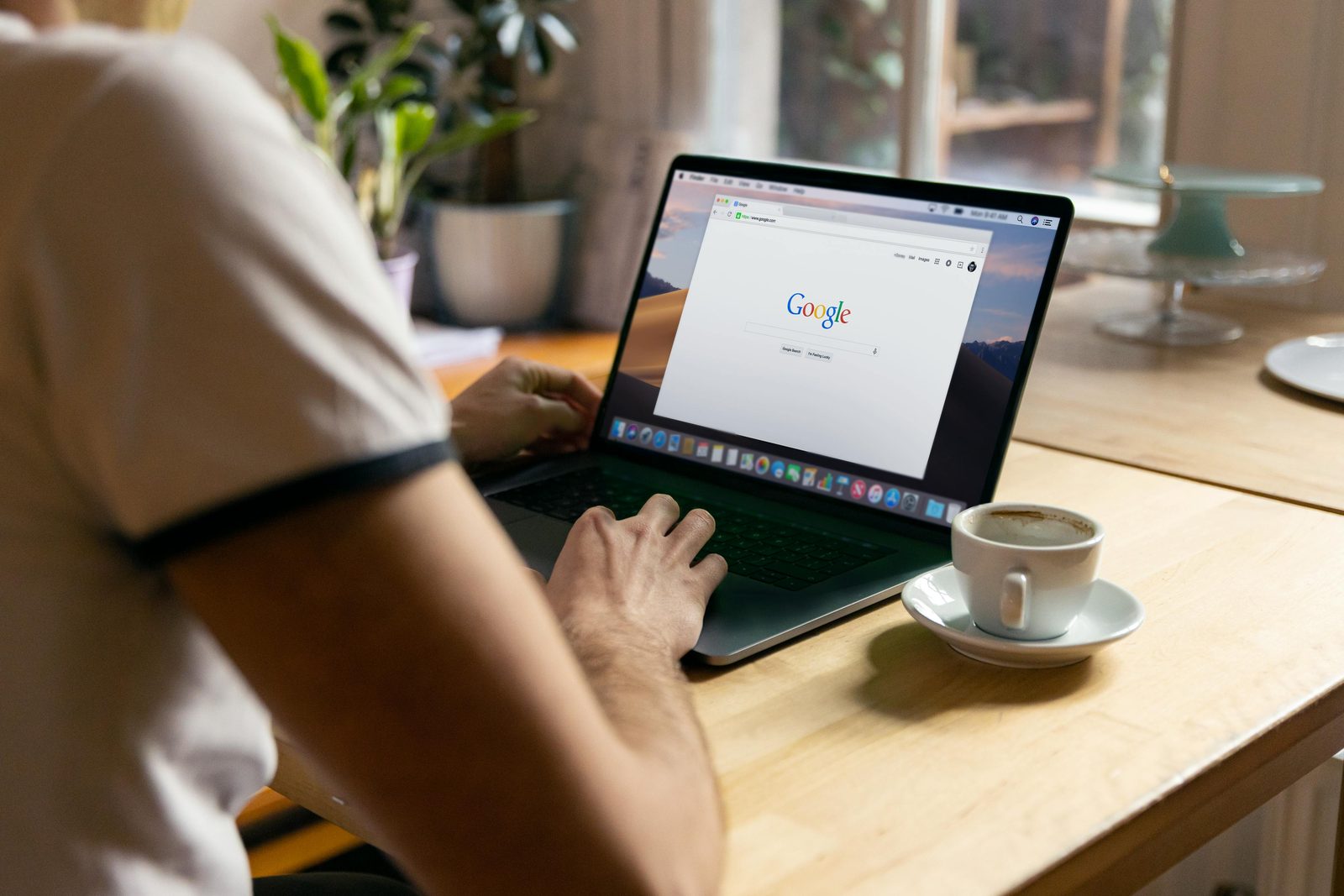 Property agent working on a laptop, building a trustworthy About page